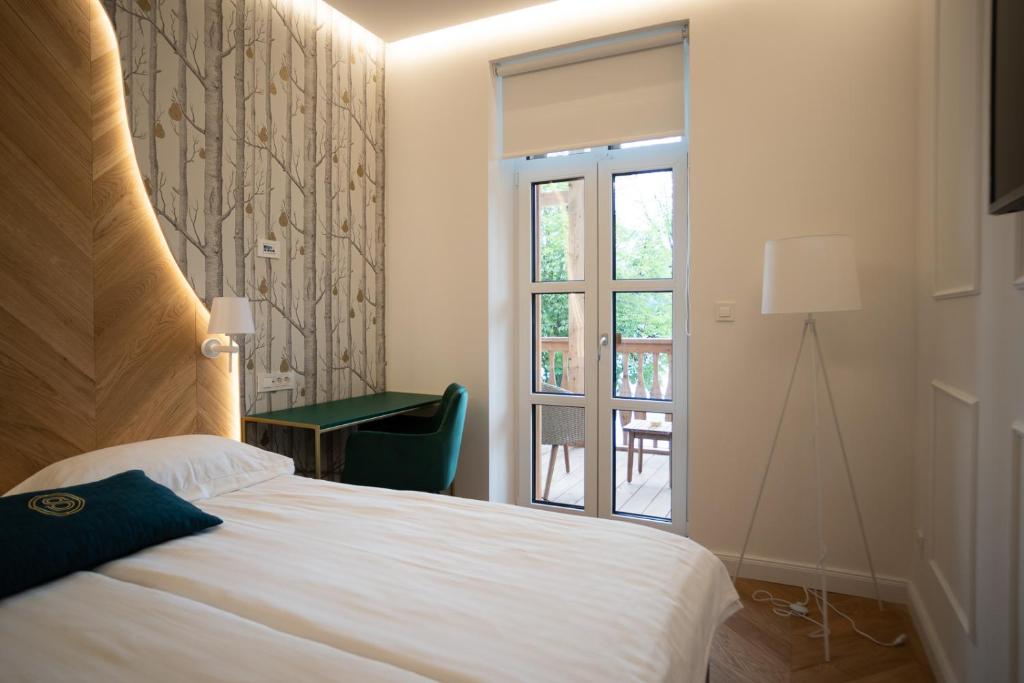 Postel nebo postele na pokoji v ubytování Hotel Starkl - Heritage & Unique