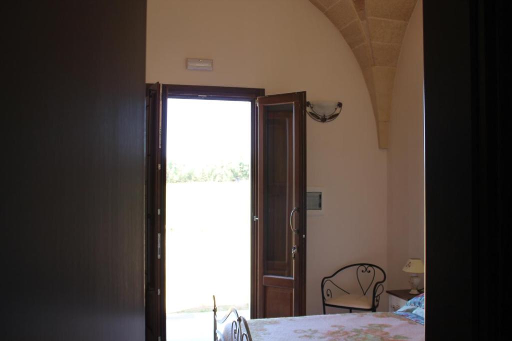 Postel nebo postele na pokoji v ubytování Masseria Cricelli