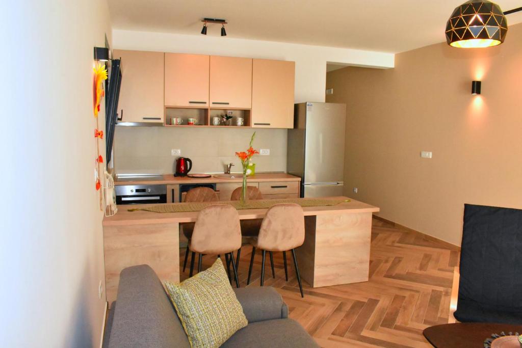 Kuchyň nebo kuchyňský kout v ubytování White Star Apartments