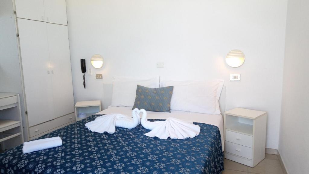 Postel nebo postele na pokoji v ubytování Hotel Marina