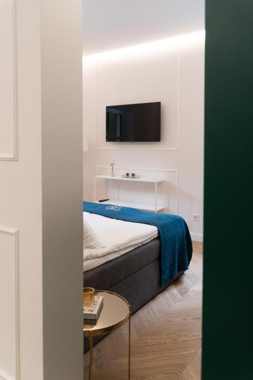 Postel nebo postele na pokoji v ubytování Hotel Starkl - Heritage & Unique