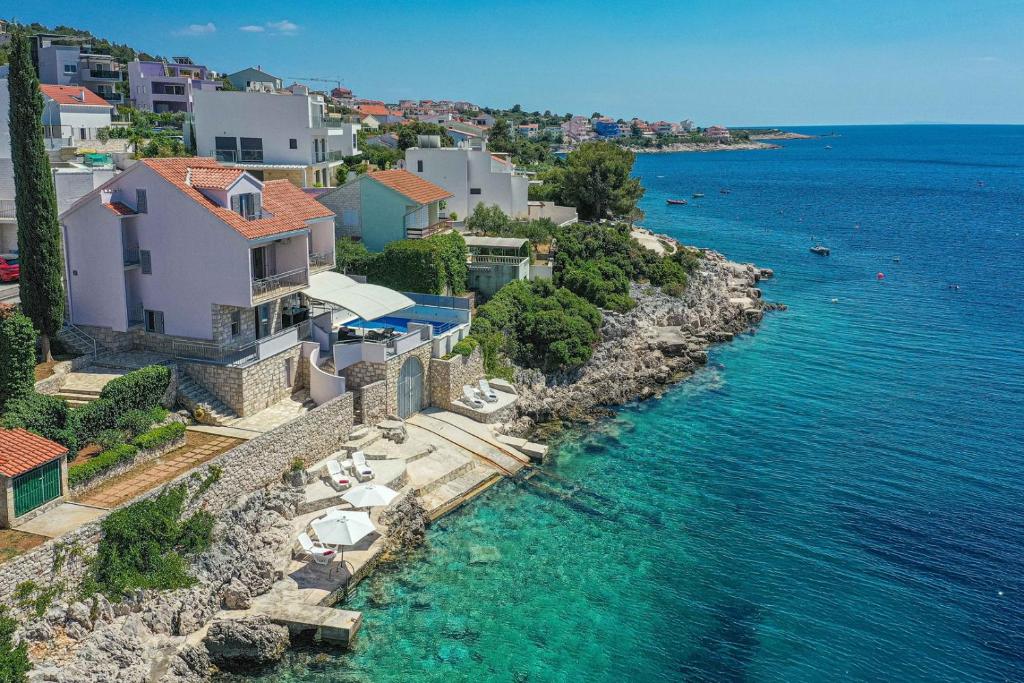 an aerial view of a house on a rocky shore at Villa Antonija 1607 in Ražanj
