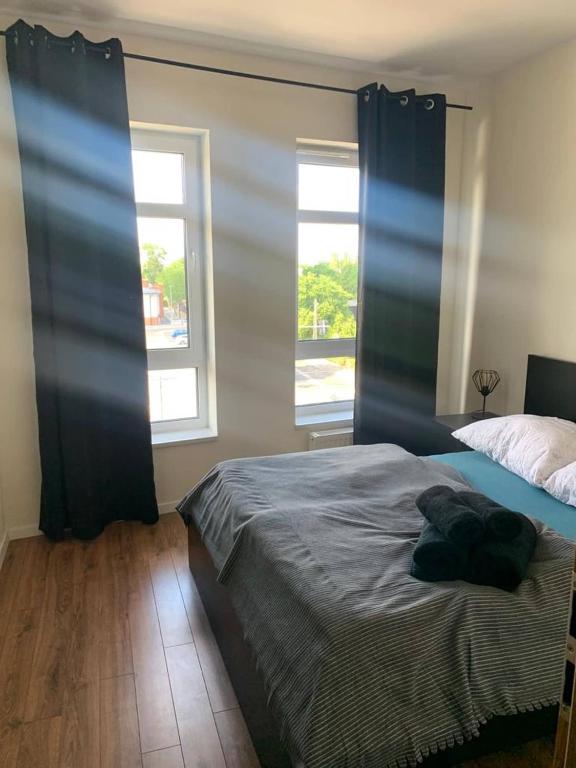 Posteľ alebo postele v izbe v ubytovaní Apartament Batory