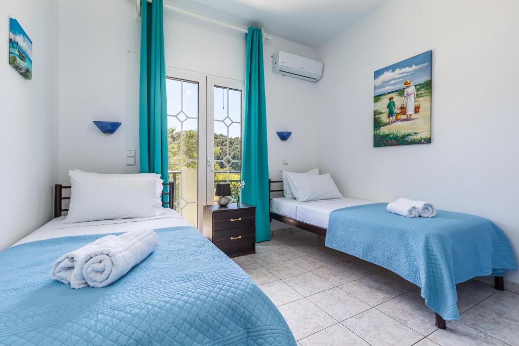 Posteľ alebo postele v izbe v ubytovaní Casa Mia - 5 min from Stafilos beach