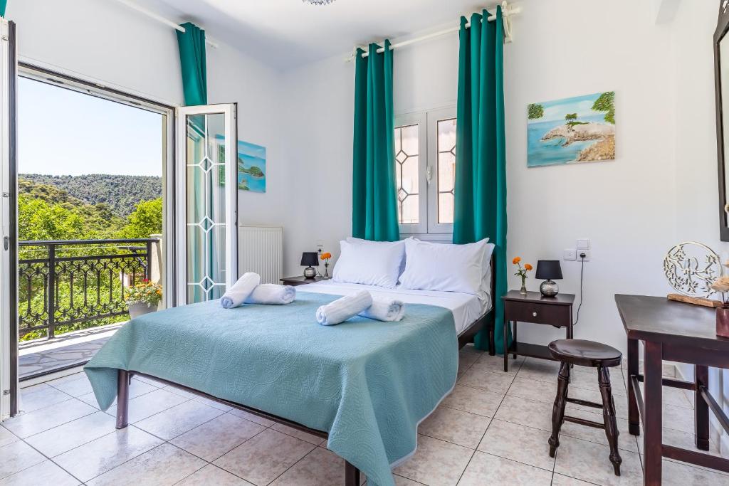Posteľ alebo postele v izbe v ubytovaní Casa Mia - 5 min from Stafilos beach