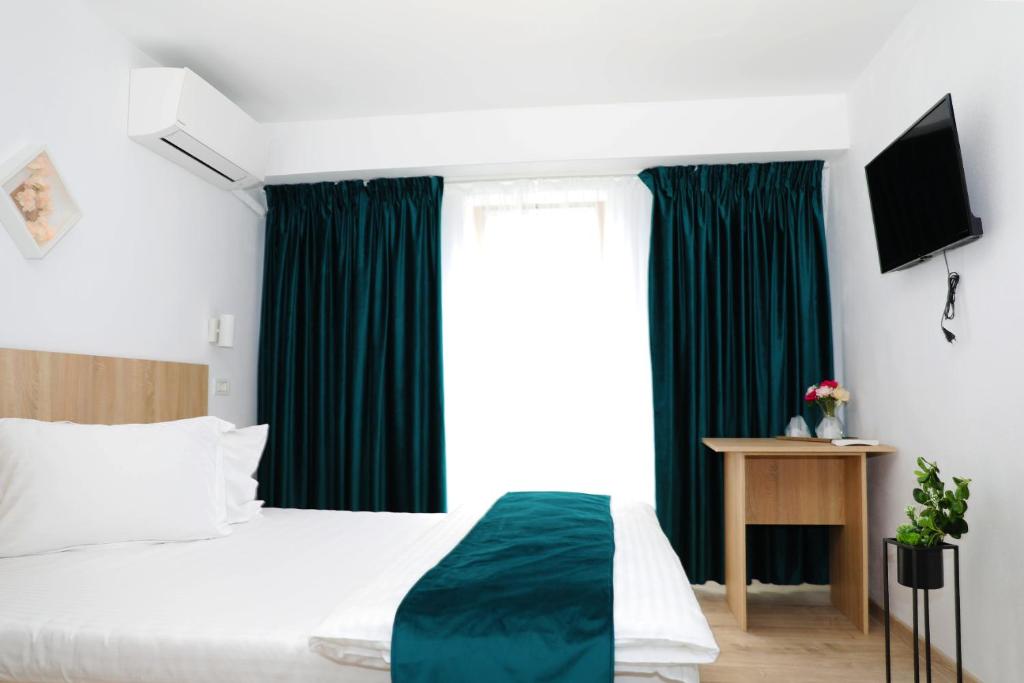 Postel nebo postele na pokoji v ubytování Hotel Dunavis