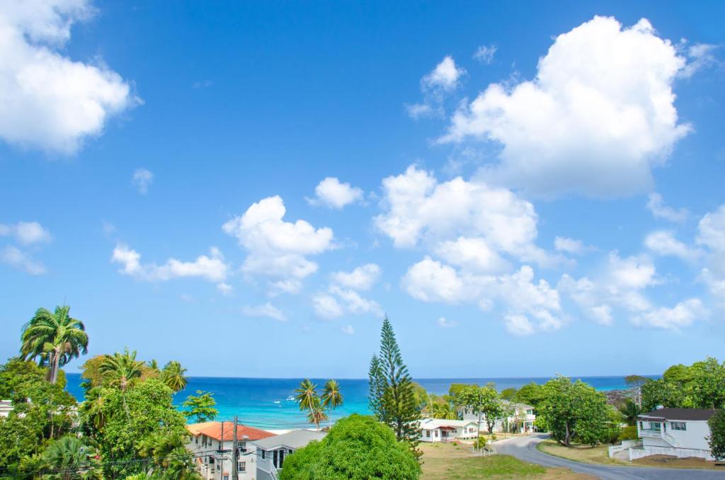 a view of the ocean from a residential street at Lantana Resort Barbados by Island Villas in Saint James