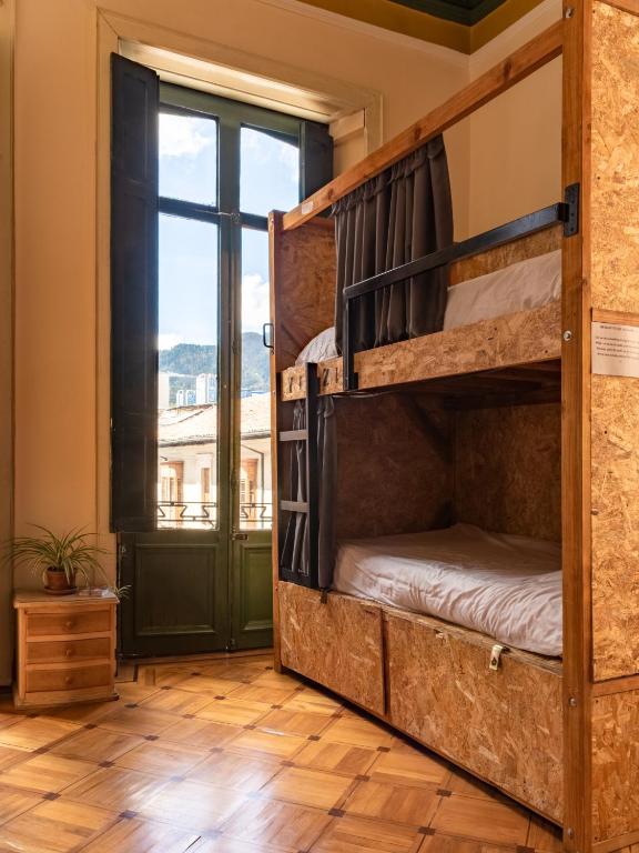 Postel nebo postele na pokoji v ubytování Hostal R10