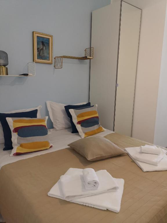 A bed or beds in a room at Loft Profumo di Mare