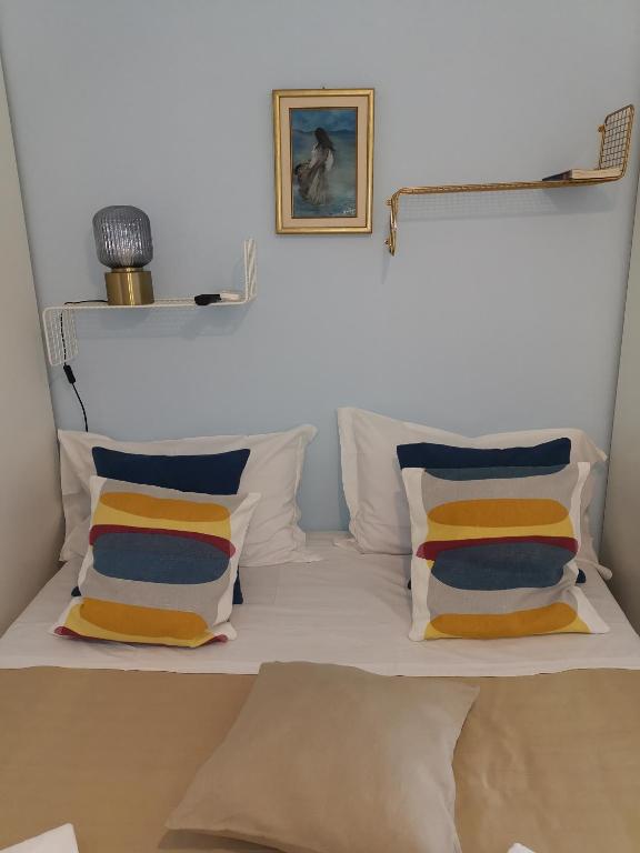 A bed or beds in a room at Loft Profumo di Mare