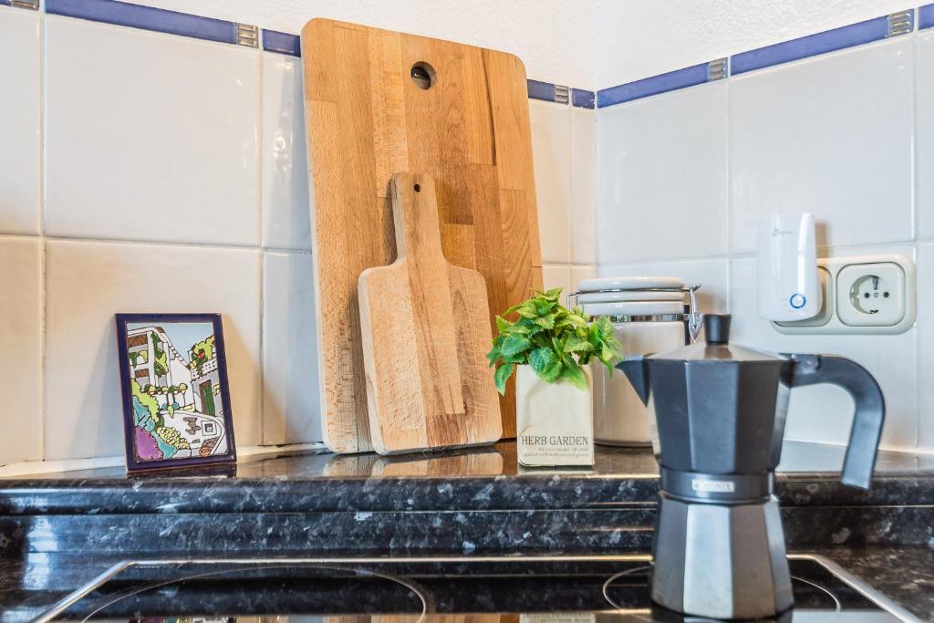 A kitchen or kitchenette at Casa Sol - traditional village house with pool and view