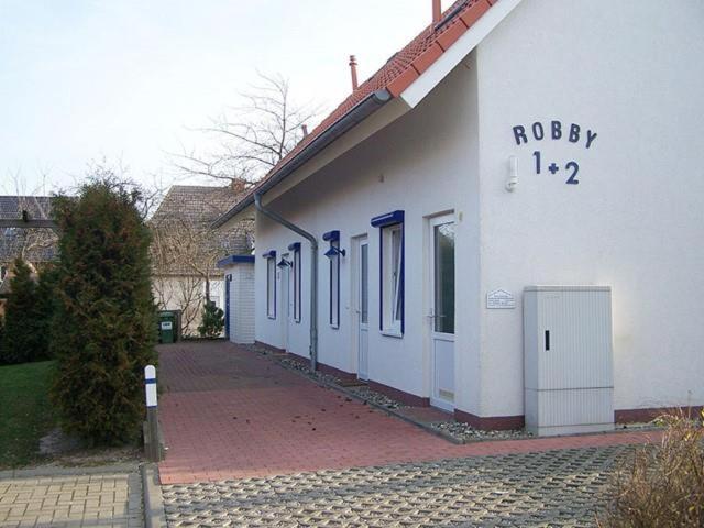 a white building with the words robey on it at Robby2 in Kaltenhof