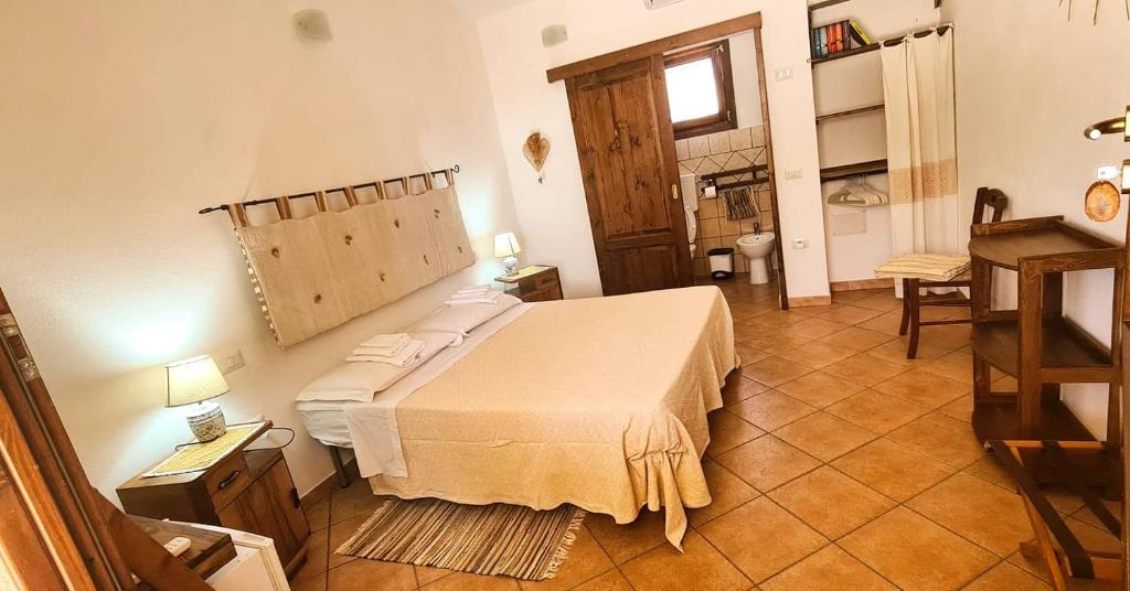 Postel nebo postele na pokoji v ubytování Agriturismo La Cresta