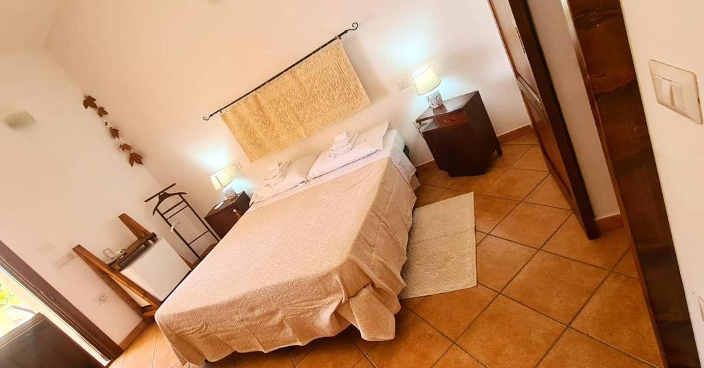 Postel nebo postele na pokoji v ubytování Agriturismo La Cresta