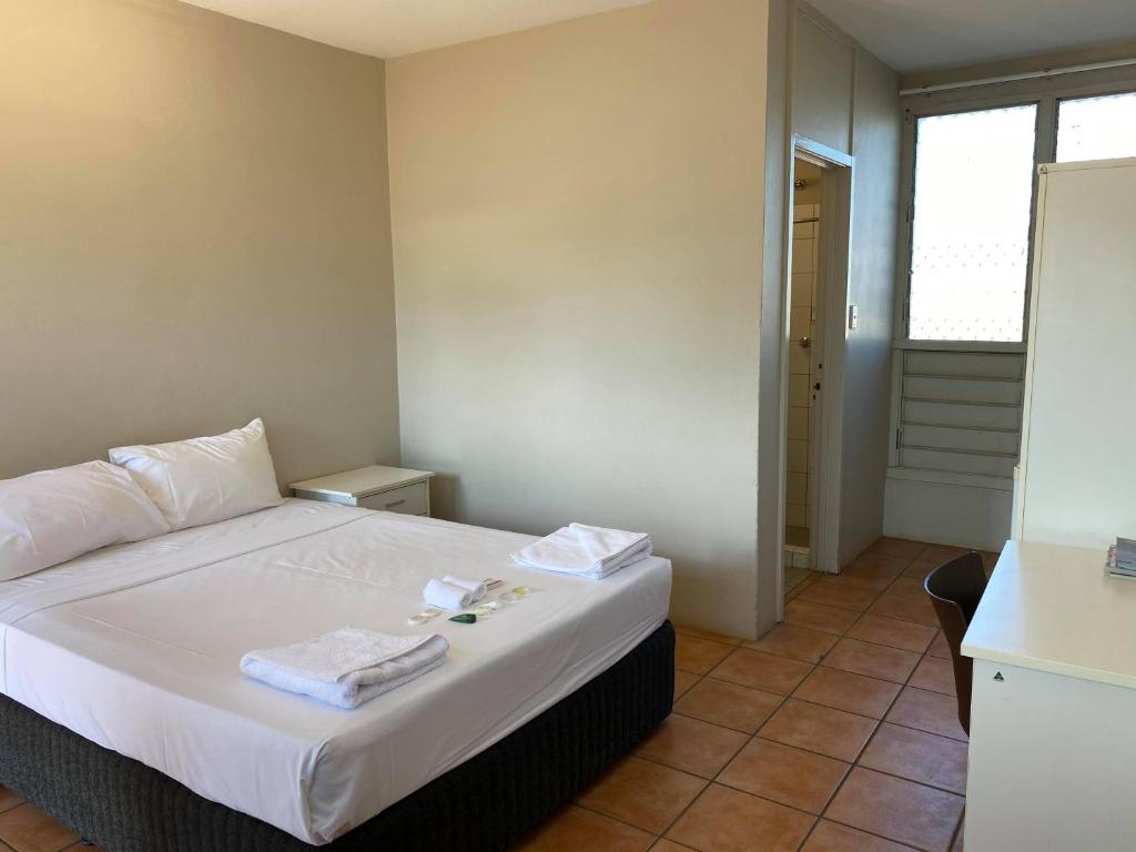 Postel nebo postele na pokoji v ubytování Darwin Resort