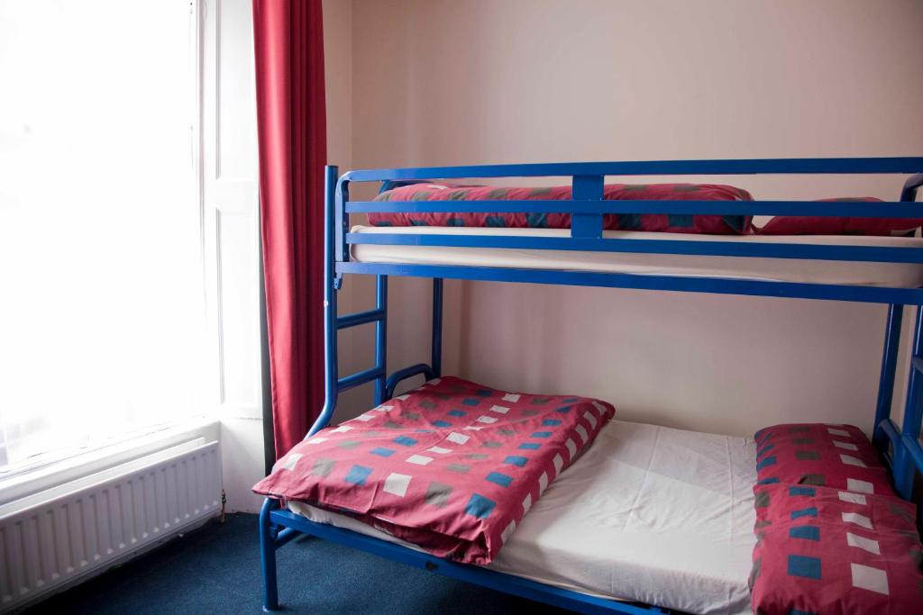 Postel nebo postele na pokoji v ubytování Ashfield Hostel
