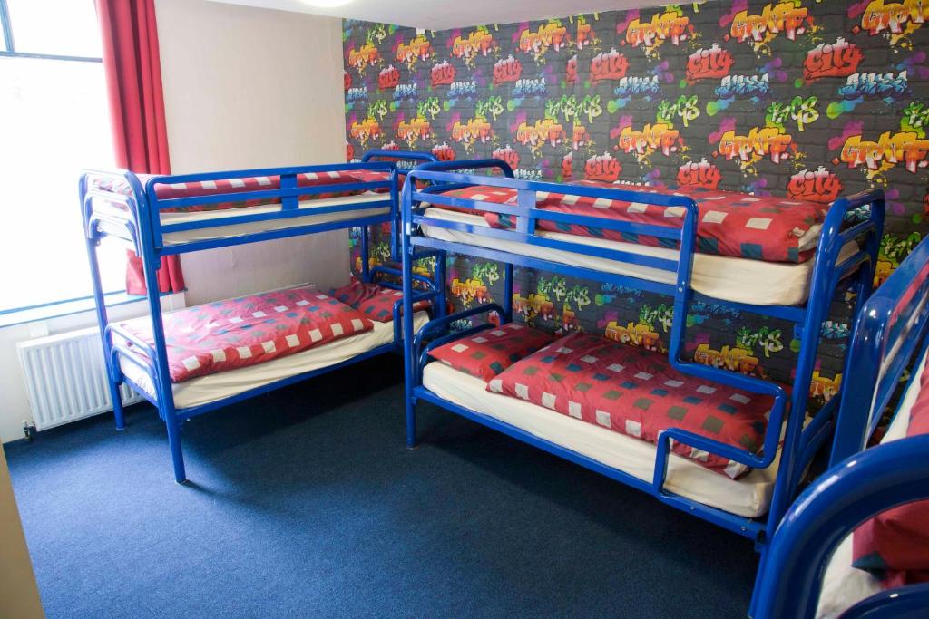 Postel nebo postele na pokoji v ubytování Ashfield Hostel