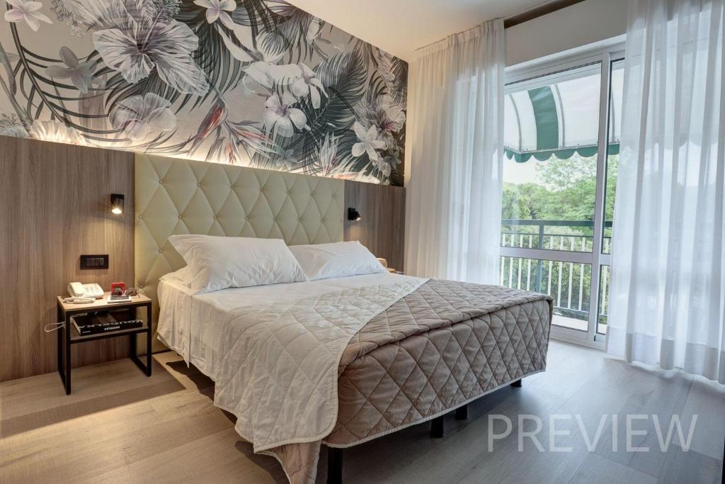 Postel nebo postele na pokoji v ubytování Hotel Picobello Pineta