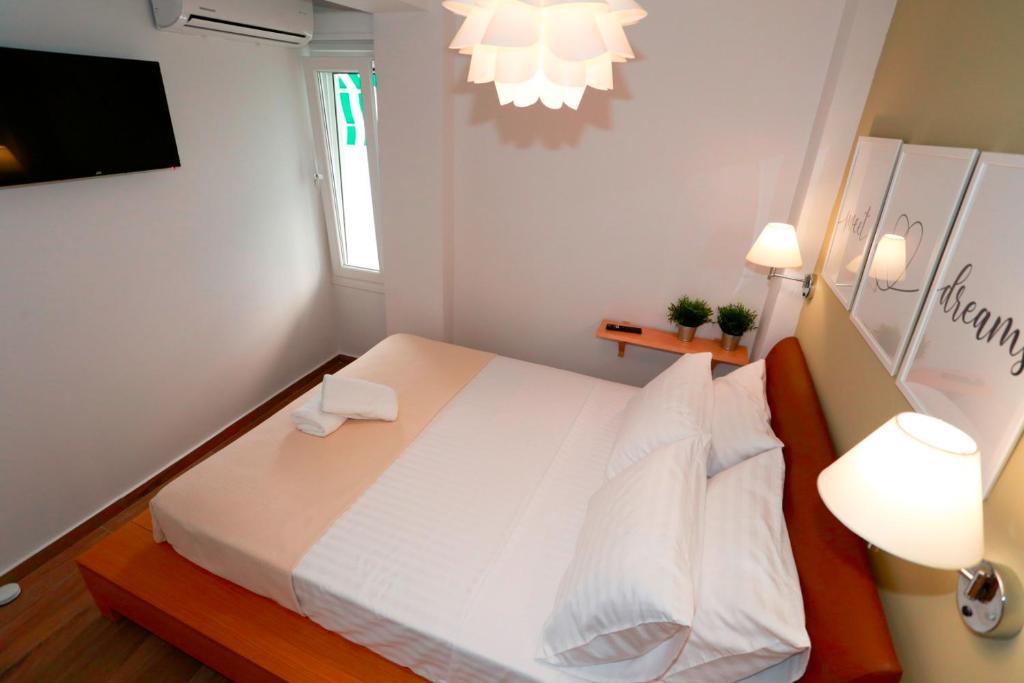 Postel nebo postele na pokoji v ubytování Bianca Suites