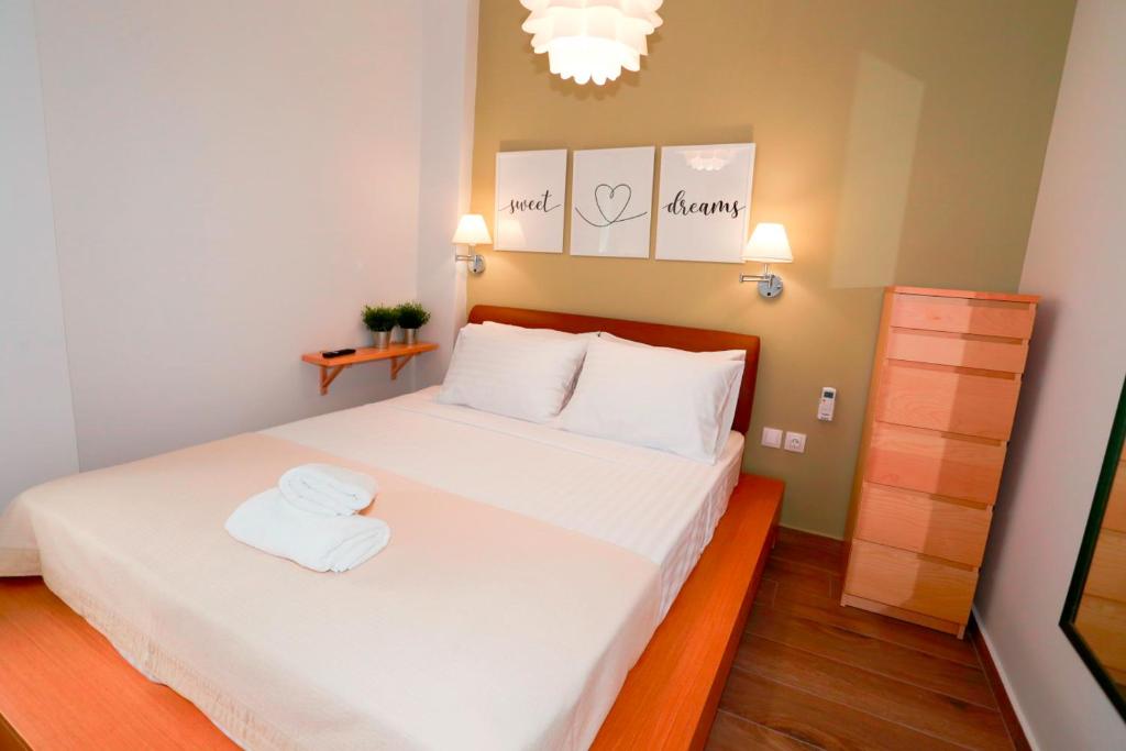 Ένα ή περισσότερα κρεβάτια σε δωμάτιο στο Bianca Suites