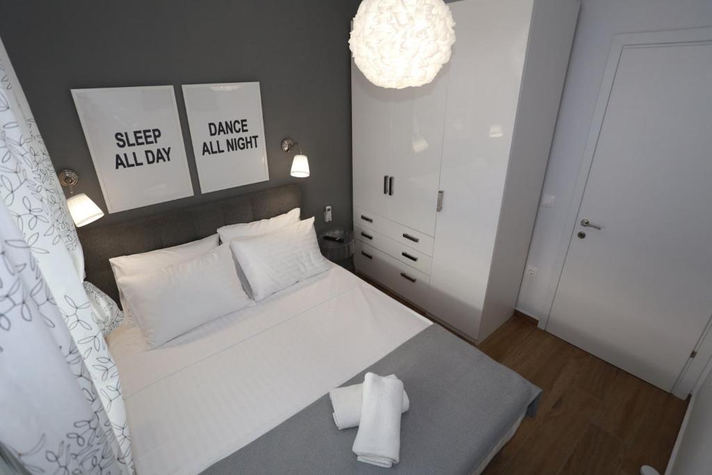 Postel nebo postele na pokoji v ubytování Bianca Suites