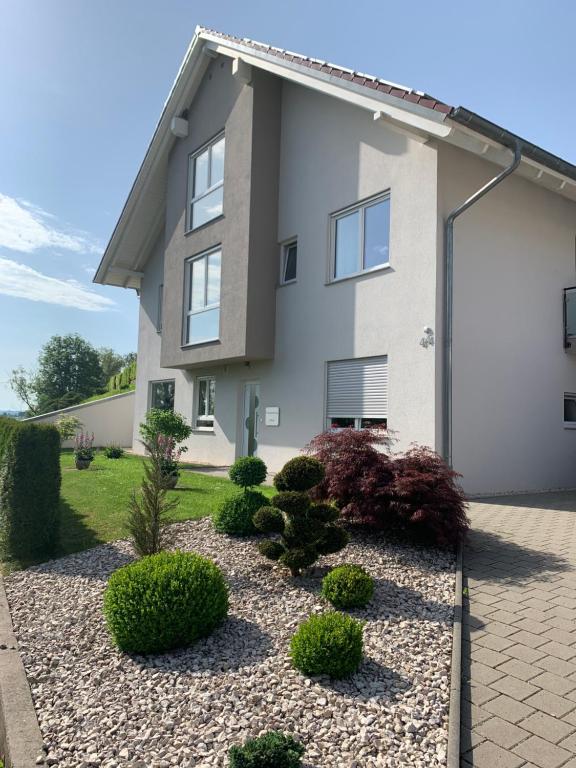 a house with a landscaping in front of it at Ferienwohnung Simon in Freudenstadt