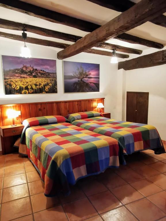 Postel nebo postele na pokoji v ubytování Casa independiente y completa con una habitación "Venta de Cidones"