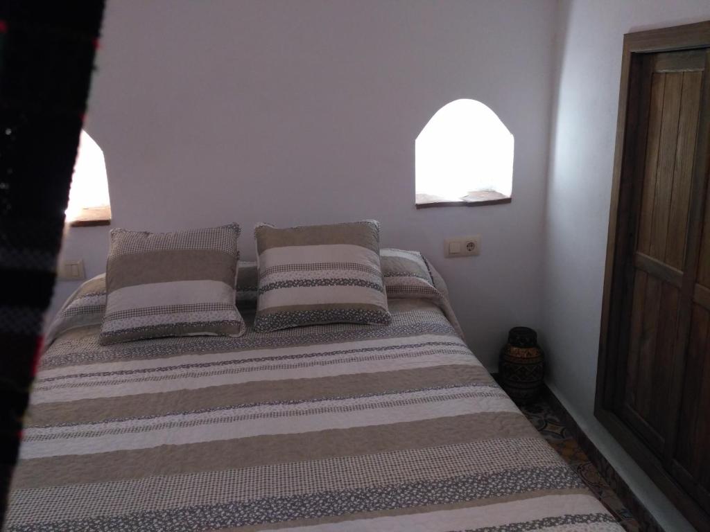 Postel nebo postele na pokoji v ubytování Casa Cueva EL ZAGAL