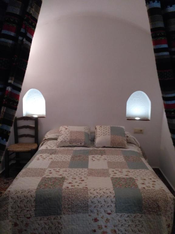 Postel nebo postele na pokoji v ubytování Casa Cueva EL ZAGAL