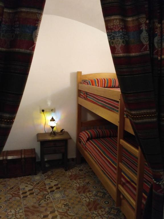 Postel nebo postele na pokoji v ubytování Casa Cueva EL ZAGAL