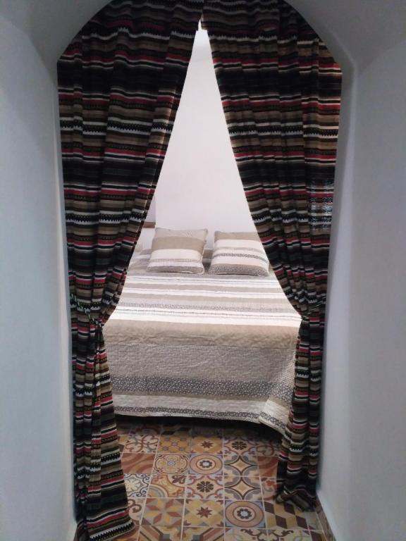 Postel nebo postele na pokoji v ubytování Casa Cueva EL ZAGAL