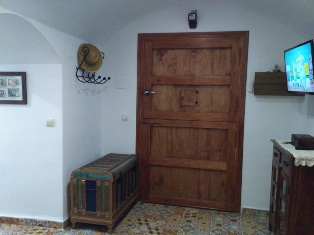 TV a/nebo společenská místnost v ubytování Casa Cueva EL ZAGAL