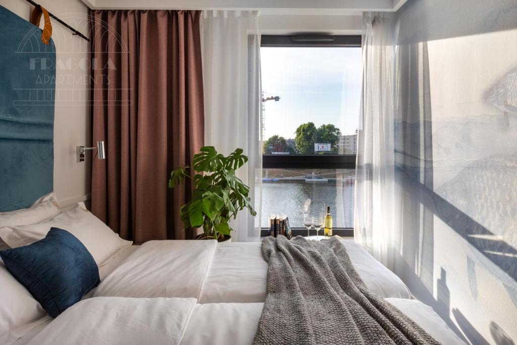 Posteľ alebo postele v izbe v ubytovaní Fragola Apartments Vistula View