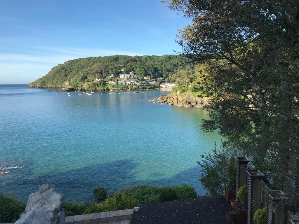 a view of a large body of water at 2 bed apartment overlooking North Sands beach in Salcombe