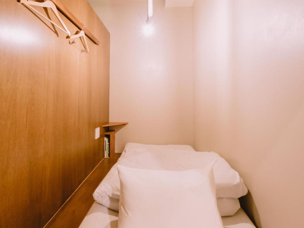 Postel nebo postele na pokoji v ubytování Guesthouse Hitoyado
