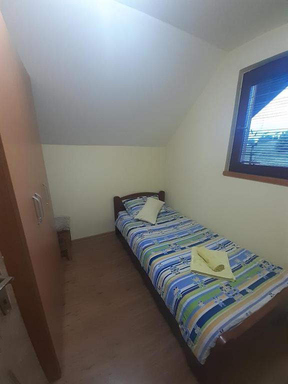 Postel nebo postele na pokoji v ubytování Apartman Bambi Zlatar