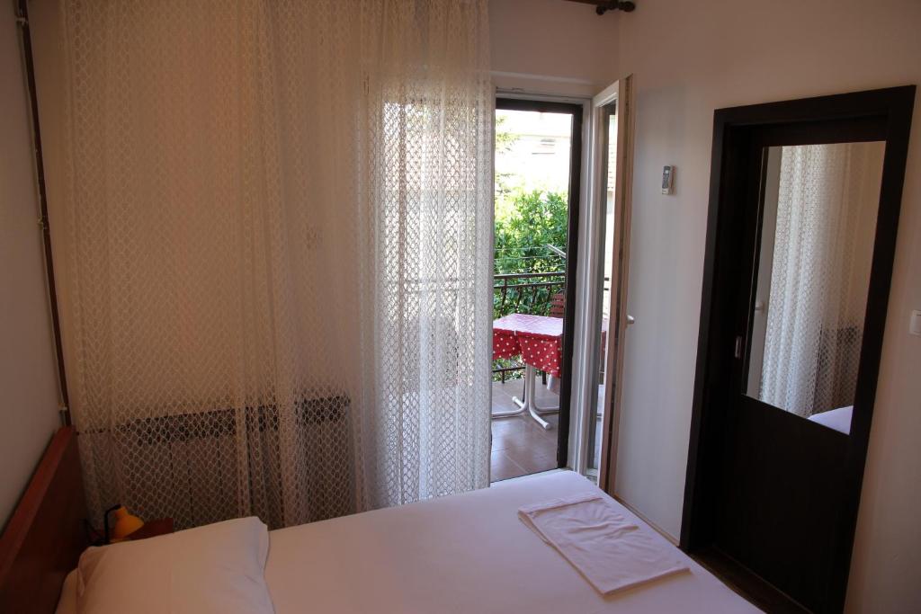 Postel nebo postele na pokoji v ubytování Obradović rooms & apartments