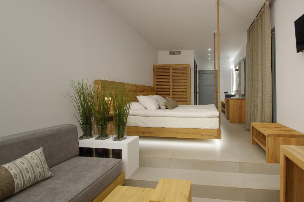 Postel nebo postele na pokoji v ubytování Oro Suites