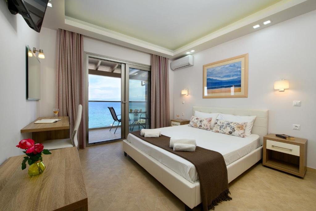 Postel nebo postele na pokoji v ubytování Villa Boukari Beach