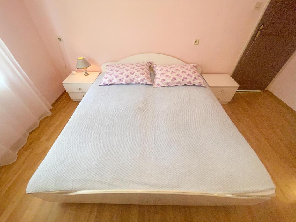 Postel nebo postele na pokoji v ubytování Apartmani Matković