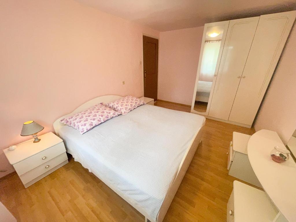 Postel nebo postele na pokoji v ubytování Apartmani Matković