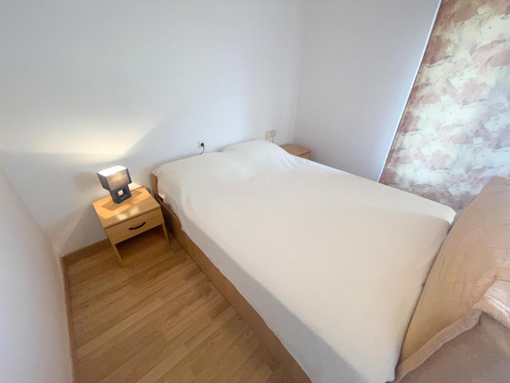Postel nebo postele na pokoji v ubytování Apartmani Matković