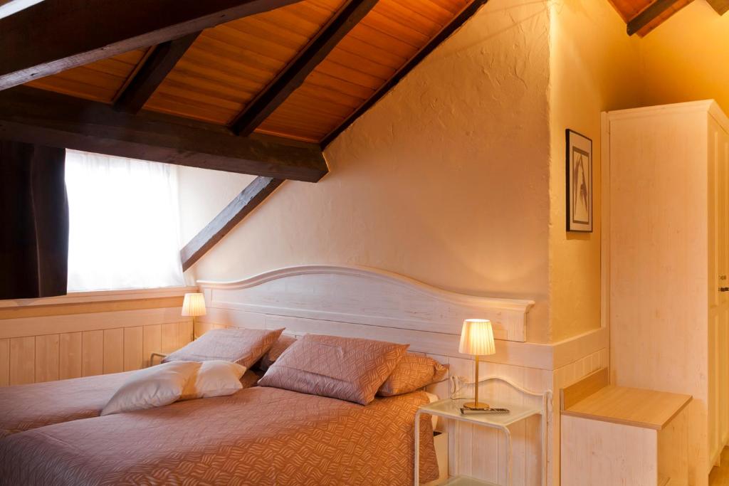 Letto o letti in una camera di Albergo Ristorante La Palma