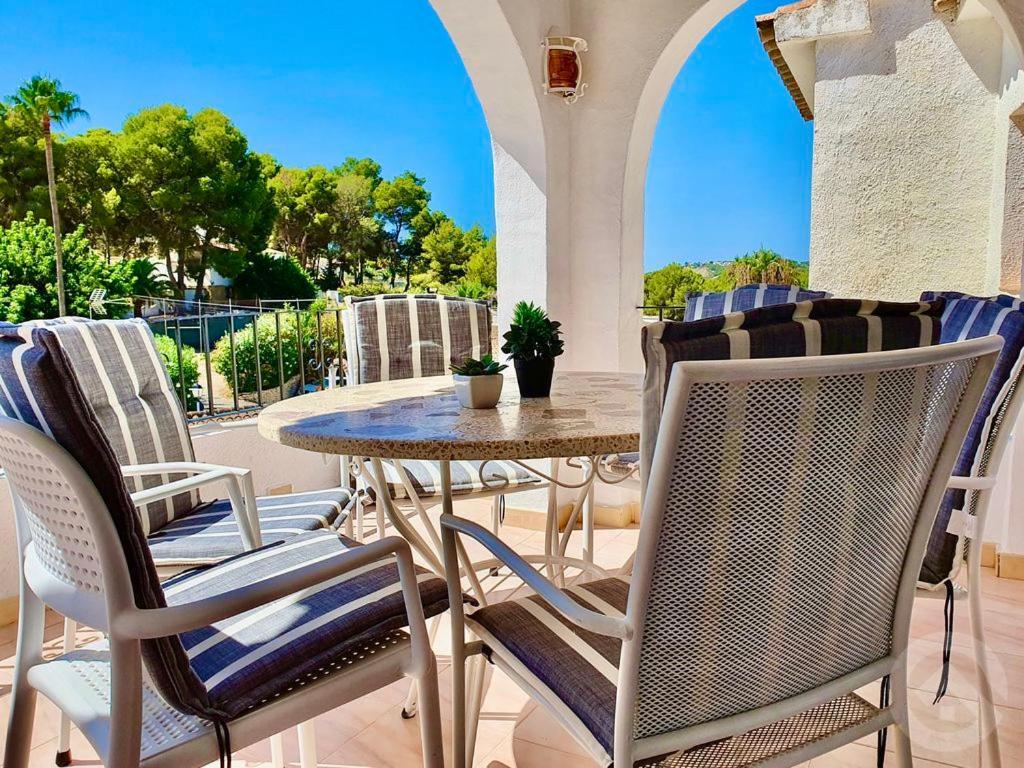 an outdoor patio with a table and chairs at Luciana in Moraira