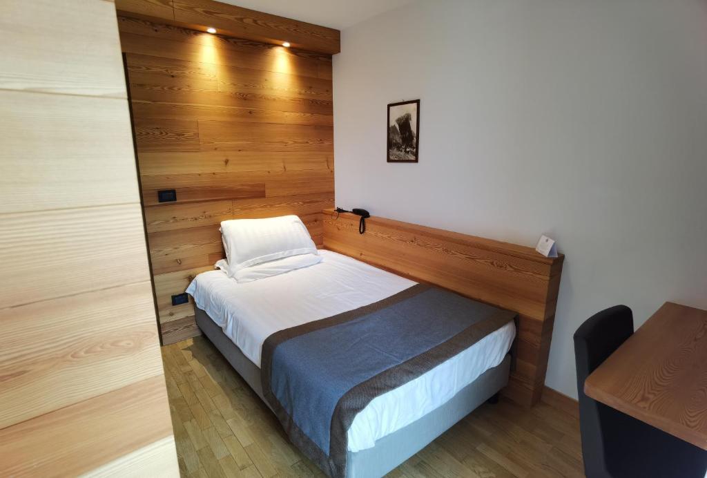 Postel nebo postele na pokoji v ubytování Hotel Croux