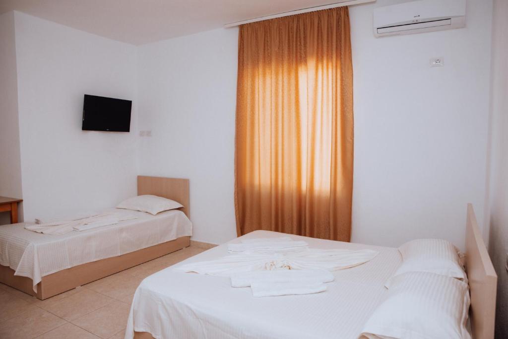Postel nebo postele na pokoji v ubytování Hotel Perdja