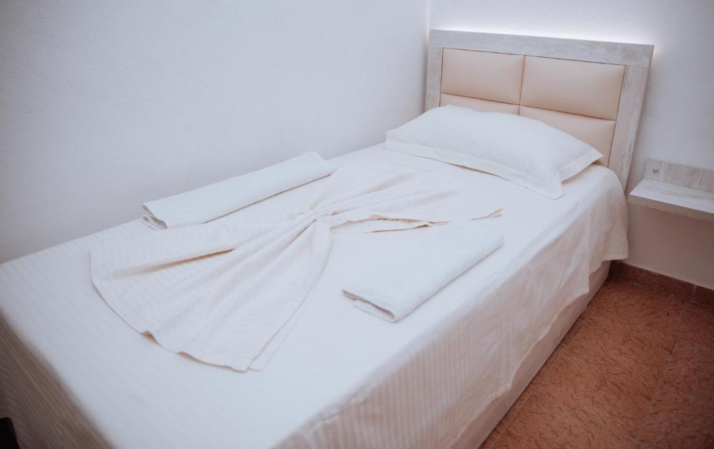 Postel nebo postele na pokoji v ubytování Hotel Perdja