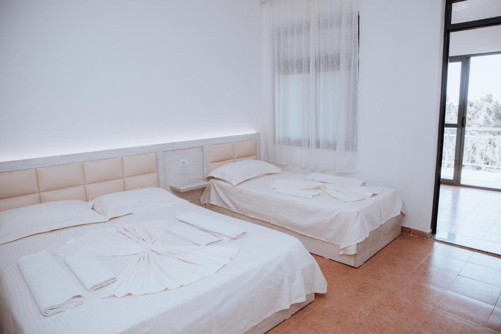Postel nebo postele na pokoji v ubytování Hotel Perdja