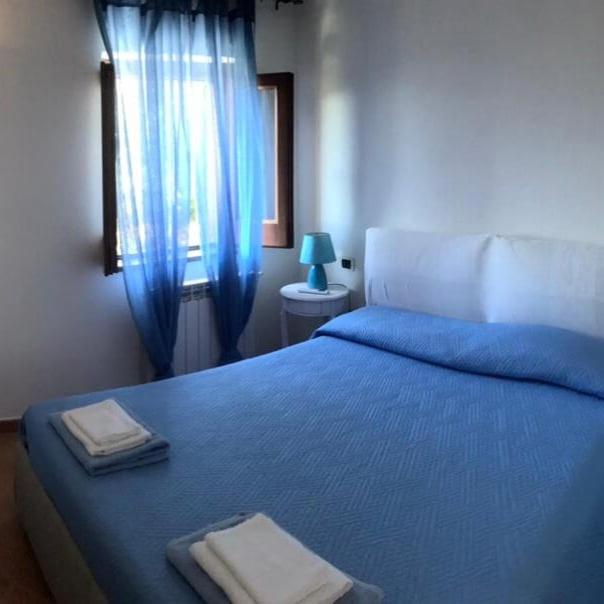 Postel nebo postele na pokoji v ubytování Il carrubo B&b