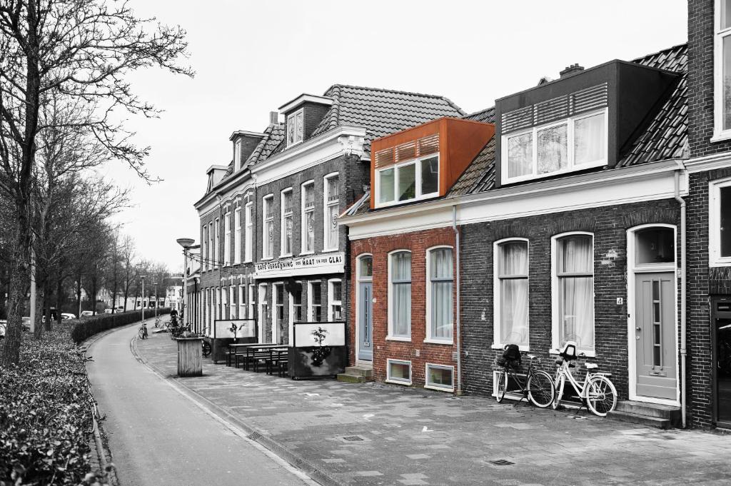 a group of buildings with bikes parked in front of them at Cozy Typical Dutch Apartments in Groningen
